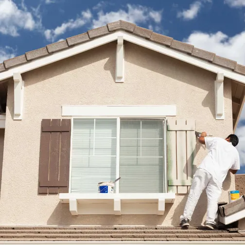 Professional House Painters are painting an exterior house