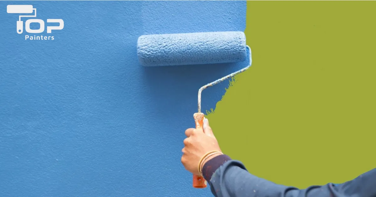 a blue building paint is applying on the wall